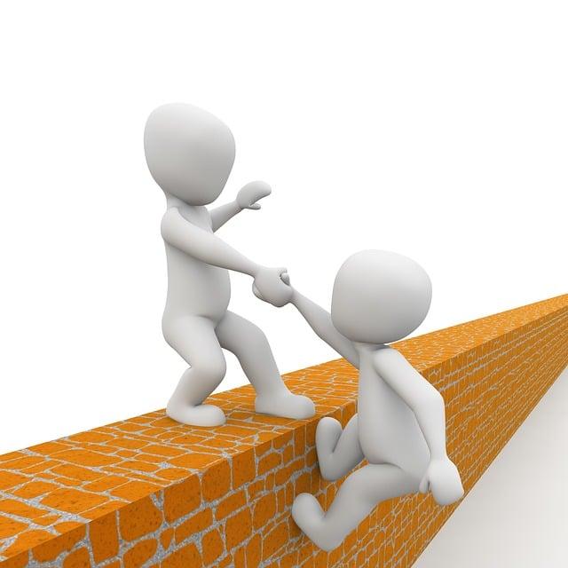 An illustration of someone helping another person over a wall