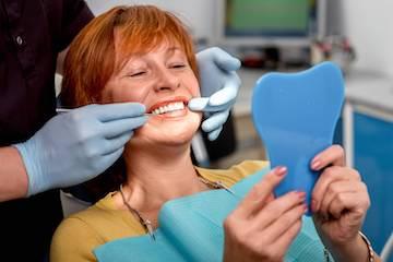 A patient examining her composite bonding