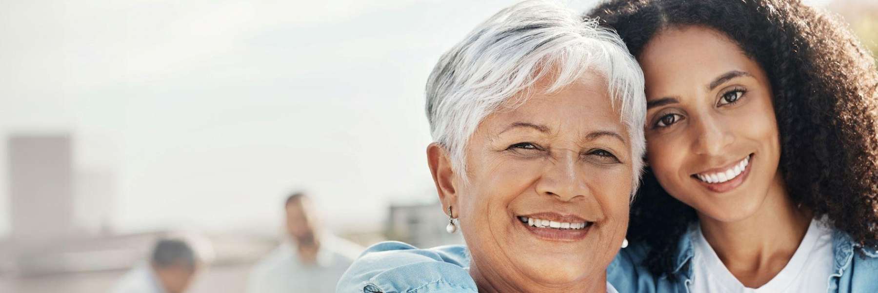 A mother and daughter posing outside | dentist 19047