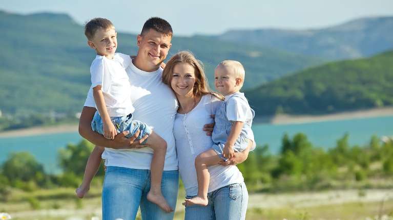 A family posing by the lake | dentist Langhorne