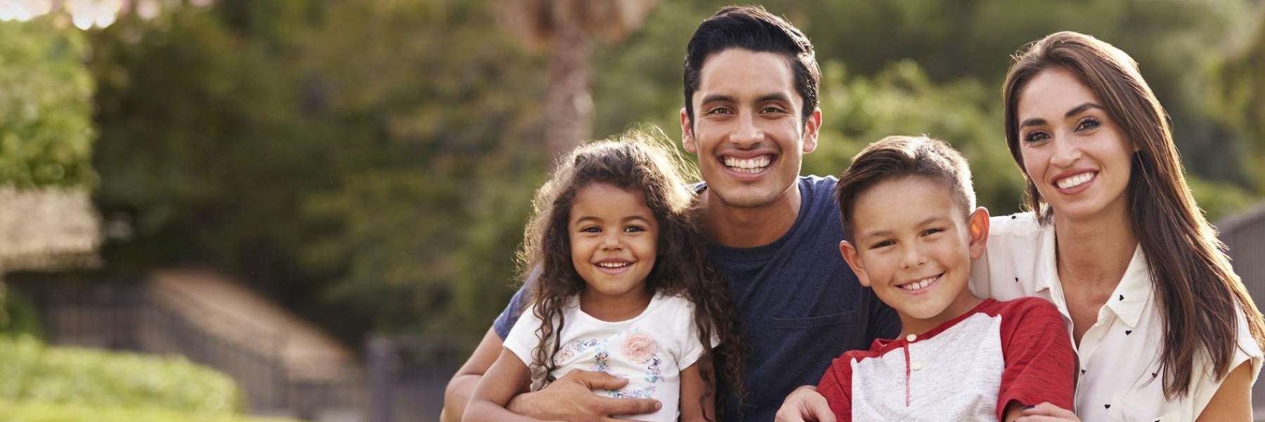 A smiling family at the park